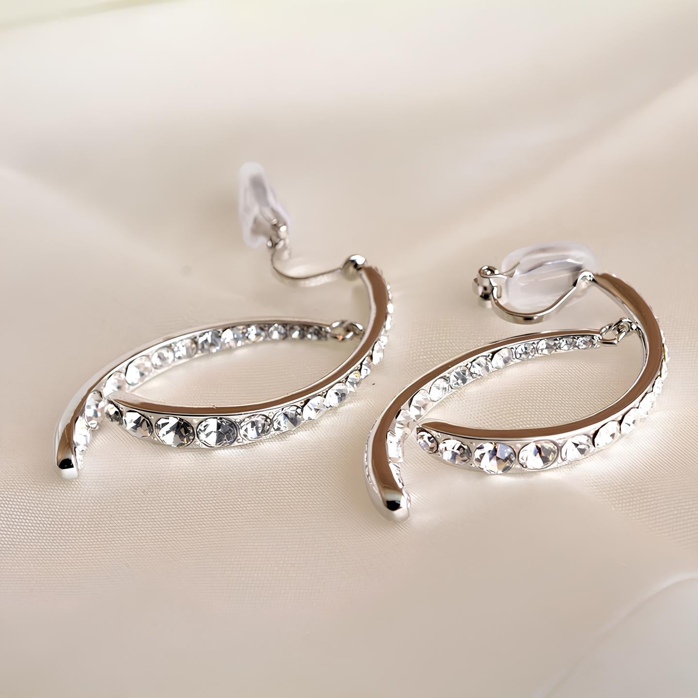 Curved cross earrings